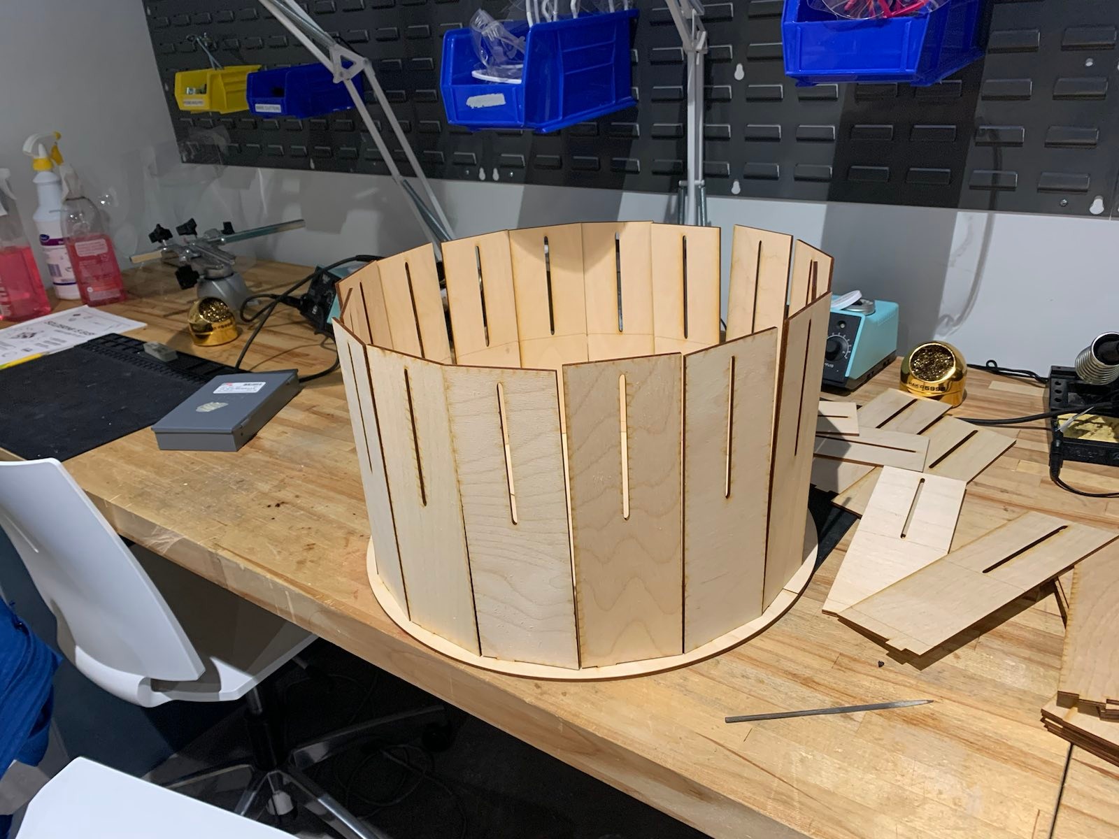 An unfinished wooden zoetrope.